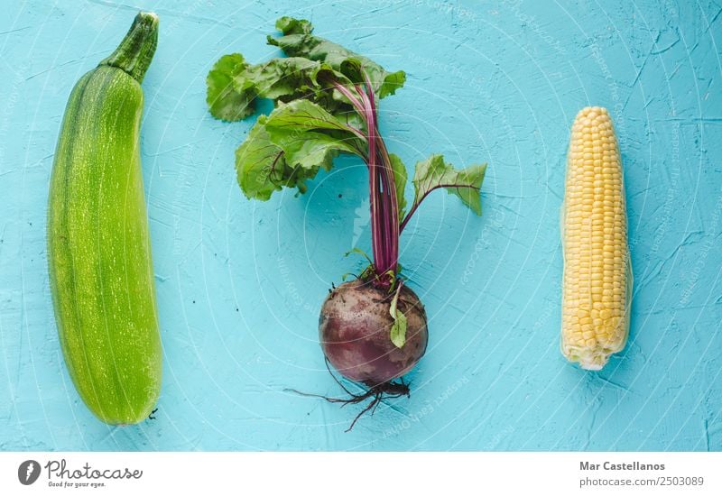 Beetroot, zucchini and corn on blue background Vegetable Nutrition Organic produce Vegetarian diet Table Kitchen Agricultural crop Fresh Natural Yellow Green