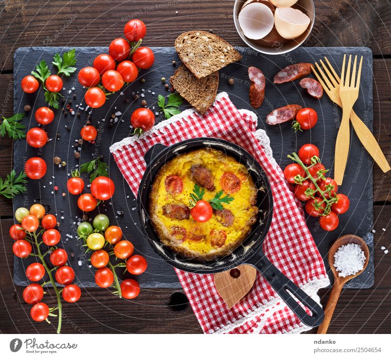 frying pan with fried omelette Sausage Vegetable Bread Breakfast Lunch Dinner Pan Fork Spoon Table Eating Fresh Above Yellow Green Tradition Omelette