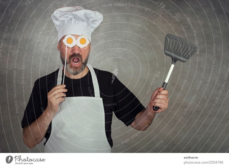 funny man with fried eggs in his eyes Nutrition Dinner Diet Cutlery Lifestyle Kitchen Restaurant Gastronomy Business Human being Masculine Young man