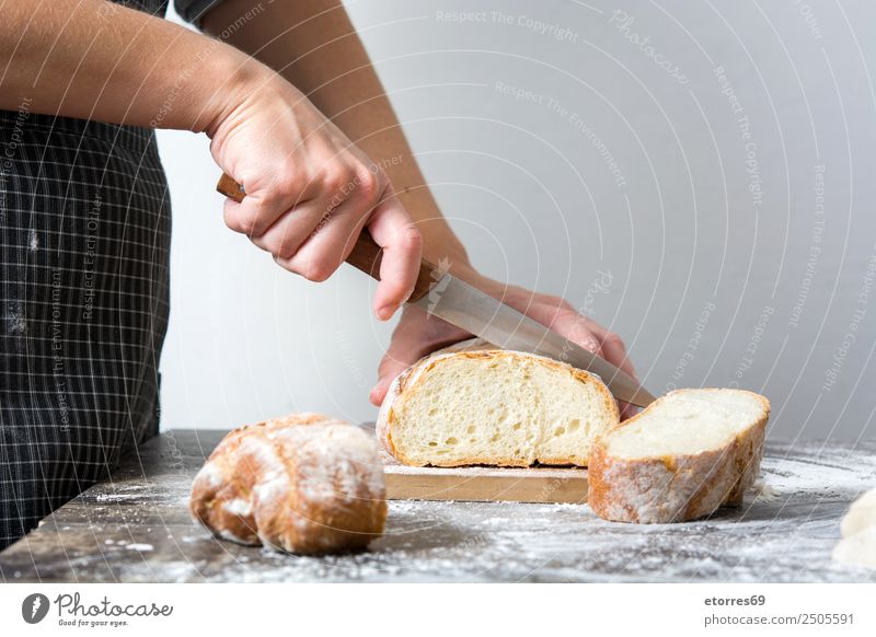 Woman cutting bread Food Bread Breakfast Feminine Adults 1 Human being 30 - 45 years Work and employment Fresh Healthy Cutting tool Knives Kitchen Hand