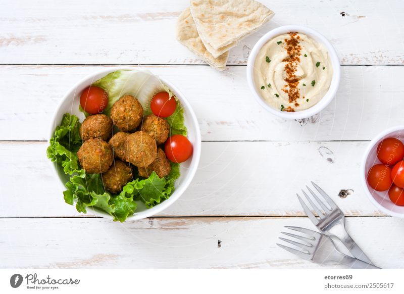 Falafel and vegetables on white wooden background. Food Healthy Eating Dish Food photograph Vegetable Grain Asian Food Bowl Fresh Brown falafel Chickpeas Tomato