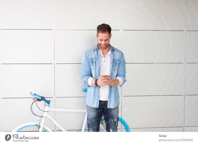Casual guy Lifestyle Style Happy Music Business Telephone PDA Technology Human being Man Adults Street Beard Smiling Stand Retro Smart Blue young mobile bicycle