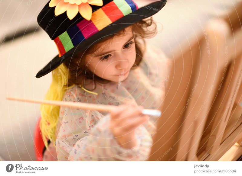 Happy little girl painting a picture Playing Sun Child Craft (trade) Toddler Girl Infancy 1 Human being 3 - 8 years Art Hat Smiling Small Funny Cute Creativity