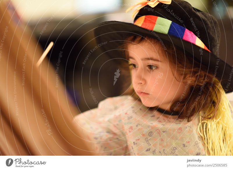 Happy little girl painting a picture at home Playing House (Residential Structure) Child Feminine Toddler Girl Infancy 1 Human being 3 - 8 years Art Hat