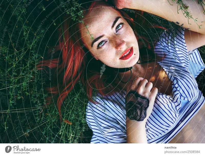 Young redhead woman lying over plants Lifestyle Style Beautiful Hair and hairstyles Skin Face Freckles Wellness Harmonious Well-being Human being Feminine