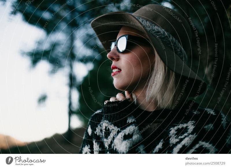 Close up portrait of blonde woman with sunglasses and a hat looking away at nature Lifestyle Style Vacation & Travel Trip Adventure Human being Feminine