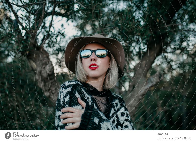 Portrait of blonde woman with sunglasses and a hat posing in nature Lifestyle Style Vacation & Travel Trip Adventure Human being Feminine Young woman