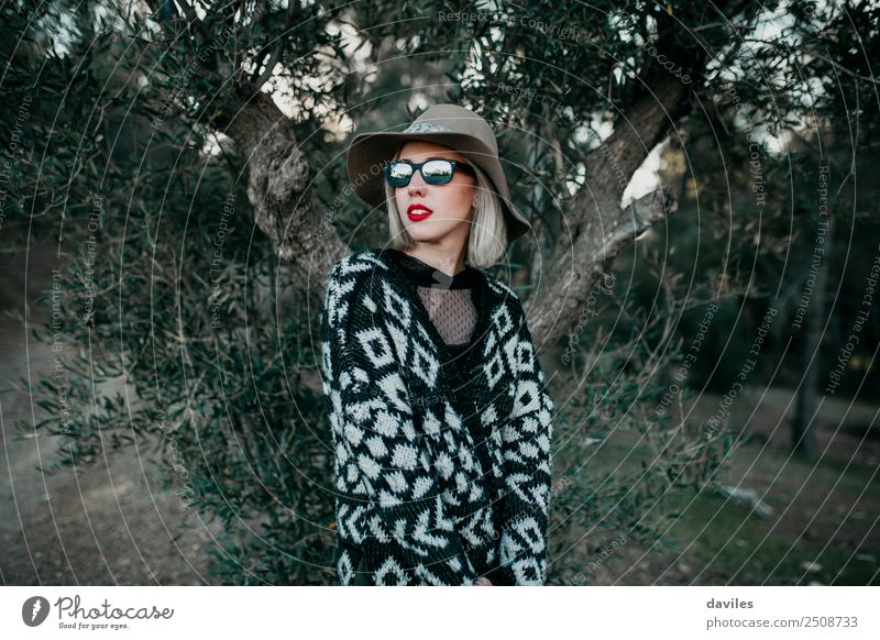 Blonde woman with a hat and sunglasses posing with an olive tree in the background Lifestyle Luxury Elegant Style Beautiful Vacation & Travel Trip Adventure