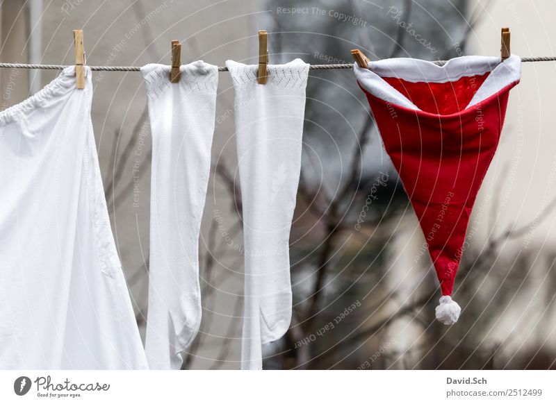 Santa Claus costume hangs to dry on a clothesline Joy Winter Christmas & Advent Workwear Stockings Underwear Cap Work and employment Red White Anticipation Help