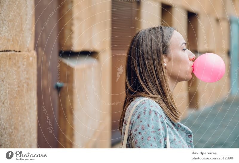 Young teenage girl blowing pink bubble gum Lifestyle Joy Happy Beautiful Face Human being Woman Adults Youth (Young adults) Mouth Lips Fashion Brunette Balloon