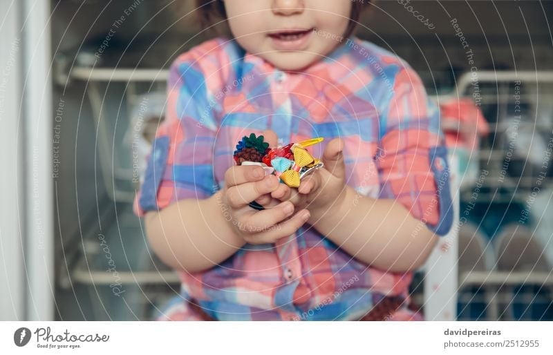 Baby girl playing with hair clips in the hands Lifestyle Joy Happy Beautiful Playing House (Residential Structure) Child Human being Woman Adults Infancy Hand