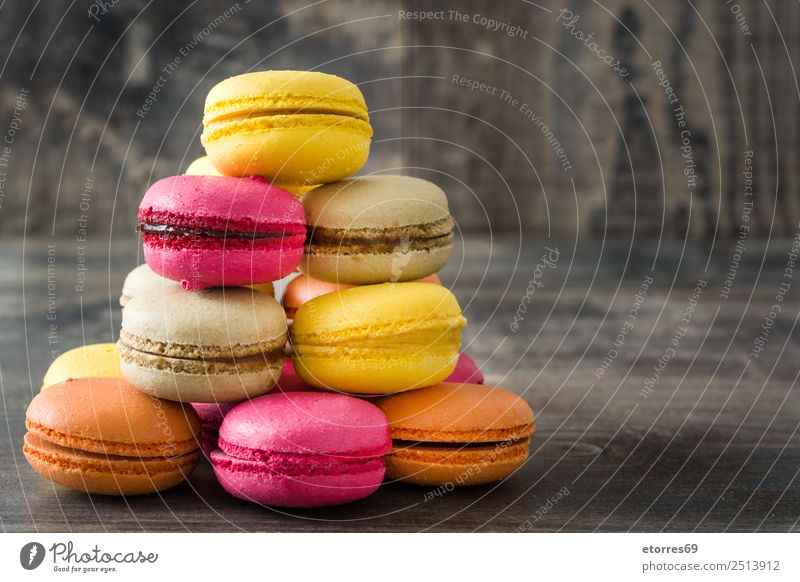 Colored macaroons on rustic wooden background Food Cake Dessert Healthy Eating Decoration Wood Delicious Sweet Pink Colour Tradition Macaron Candy