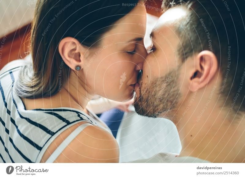 Top view of kissing couple Lifestyle Beautiful Face Human being Woman Adults Man Mother Family & Relations Couple Earring Beard Kissing Love Sit Authentic