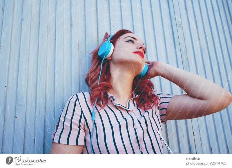 Young redhead woman listening to music Lifestyle Style Design Senses Relaxation Leisure and hobbies Headset Headphones Technology Entertainment electronics