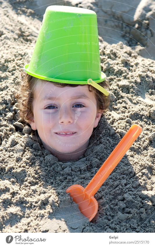 Small child buried in the sand of the beach Joy Happy Face Playing Vacation & Travel Summer Sun Beach Ocean Sports Child School Human being Boy (child) Man