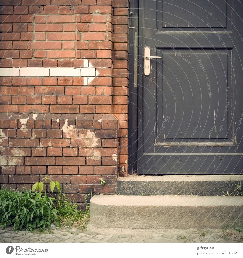 Come in! Wall (barrier) Wall (building) Stairs Facade Door Door handle Communicate Closed Arrow Signs and labeling Brick Plant Foliage plant Arise Entrance