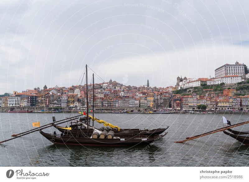 Postage with boats in the foreground Sky Clouds Coast River bank Douro Porto Town Downtown Outskirts Old town Skyline Navigation Ferry Sailing ship Rowboat