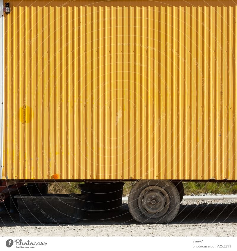 Car yellow Construction site Logistics Wall (barrier) Wall (building) Transport Means of transport Vehicle Site trailer Trailer Metal Line Stripe Old Authentic