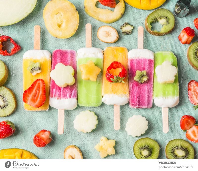 Ice on a stick with colorful fruit and fruit slices Food Fruit Ice cream Nutrition Style Design Summer Food photograph Berries Eating ice on a stick