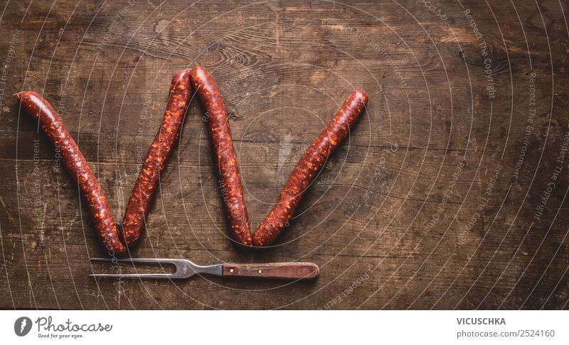 Letter W made with fried sausages Food Sausage Nutrition Fork Style Design Barbecue (apparatus) Background picture Text Symbols and metaphors Letters (alphabet)