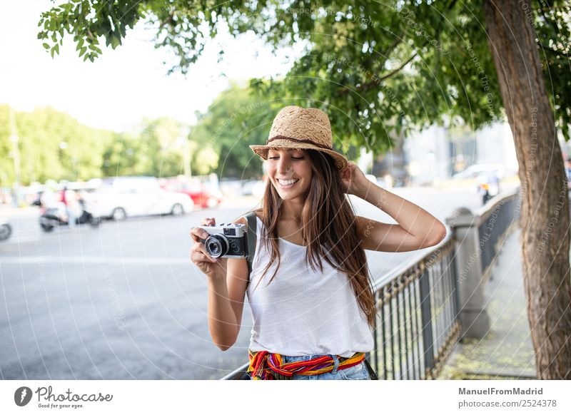 attractive young woman taking pictures outdoors Lifestyle Style Joy Beautiful Leisure and hobbies Vacation & Travel Summer Camera Technology Woman Adults Street