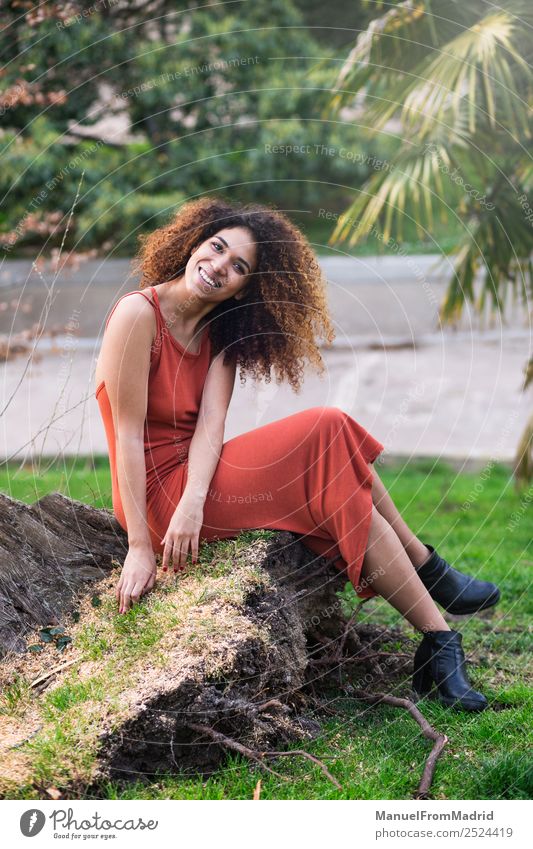 cheerful black afro woman outdoors Lifestyle Joy Happy Beautiful Face Leisure and hobbies Freedom Summer Sun Camera Human being Woman Adults Nature Tree Grass