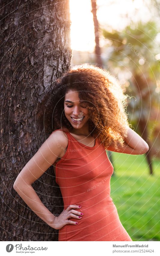 cheerful black afro woman outdoors Lifestyle Joy Happy Beautiful Face Leisure and hobbies Freedom Summer Sun Human being Woman Adults Nature Tree Grass Park