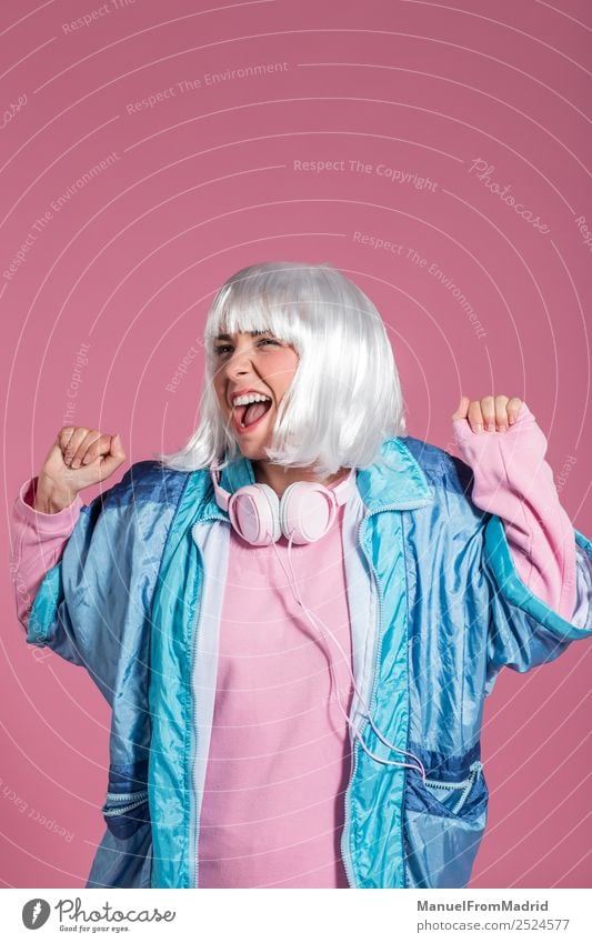 young woman with retro clothes listening to music and dancing Joy Happy Beautiful Entertainment Music Club Disco Human being Woman Adults Art Dancer Fashion Wig