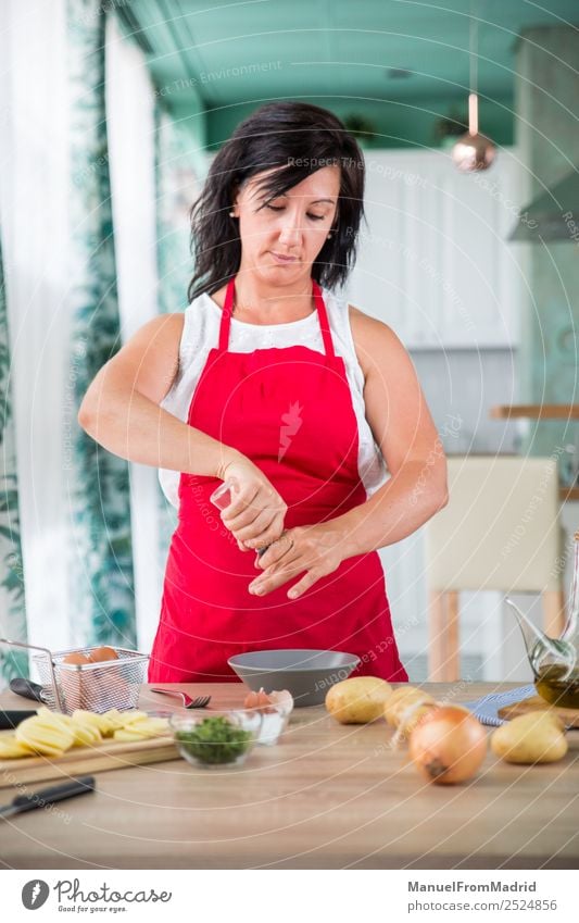woman chef preparing a recipe Nutrition Plate Table Kitchen Human being Woman Adults Hand Wood Modern cook spanish Omelette egg potatos onions food cooking Dish