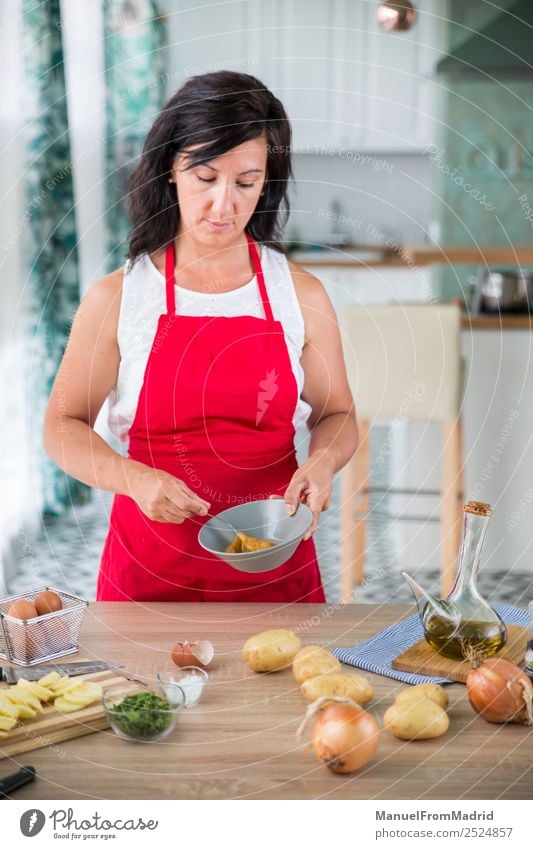 woman chef preparing a recipe Nutrition Plate Table Kitchen Human being Woman Adults Hand Wood Modern cook spanish Omelette whipping egg potatos onions food