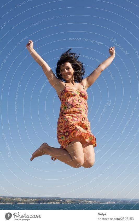 Beautiful girl jumping a over sky background Joy Happy Face Leisure and hobbies Vacation & Travel Dance Sports Success Human being Woman Adults Arm Hand Feet