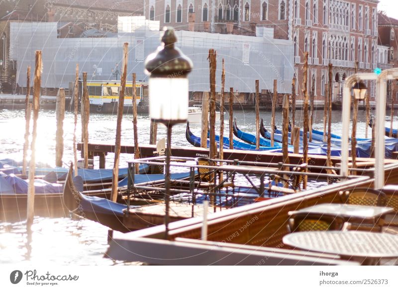 gondolas moored in the canals of Venice Elegant Beautiful Vacation & Travel Tourism Trip Harbour Bridge Building Architecture Transport Watercraft Old Historic