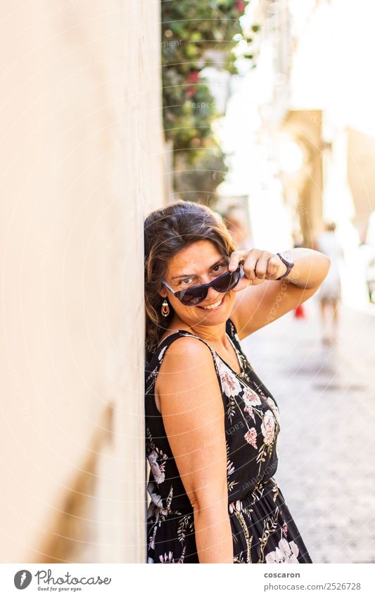 Middle aged woman on the streetwith a sunglasses Lifestyle Style Happy Beautiful Face Vacation & Travel Summer Camera Human being Feminine Woman Adults 1