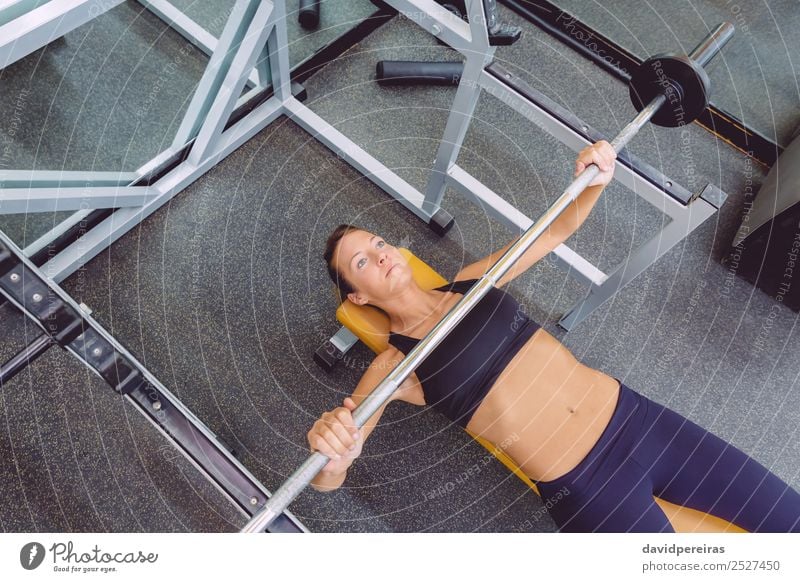Woman with barbell on a bench press training Lifestyle Beautiful Body Sports Work and employment Human being Adults Arm Fitness Authentic Muscular Strong Power