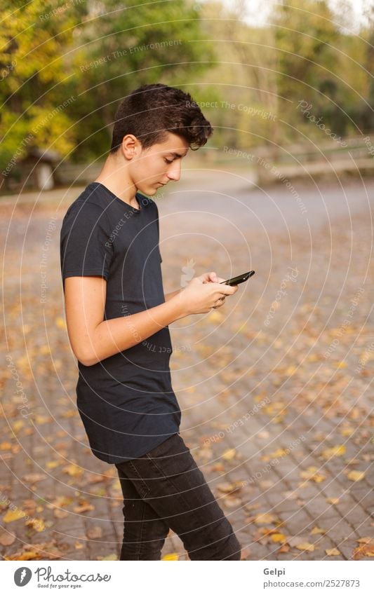 Cool teenager with fifty years old and a mobile on the street Lifestyle Happy Reading Telephone Cellphone PDA Technology Internet Human being Boy (child) Man