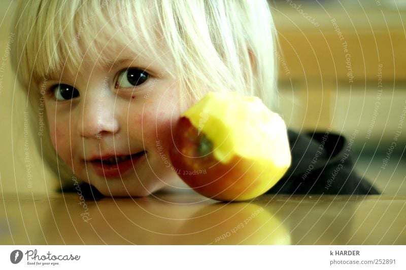 apple a day keeps the doctor away Human being Toddler Girl 1 1 - 3 years Eating Happiness Fresh Glittering Happy Multicoloured Yellow Colour photo Interior shot