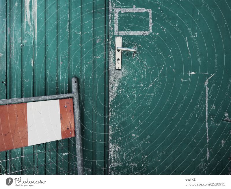 Bauhaus Door Container shed Door handle Hoarding Corrugated-iron hut Metal Old Red Turquoise White Warn Safety Scratch mark Tracks Ravages of time Colour photo