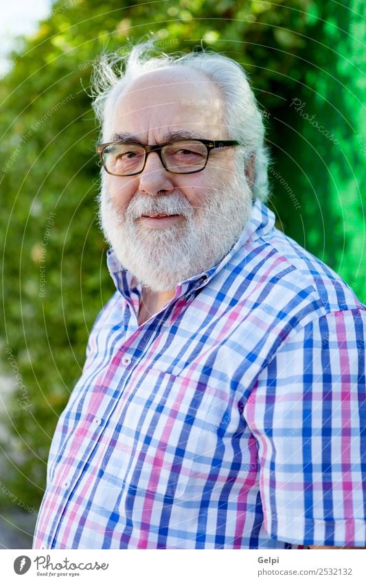 Portrait of senior man with white beard in the street Lifestyle Happy Face Calm Leisure and hobbies Summer Garden Retirement Human being Man Adults Grandfather