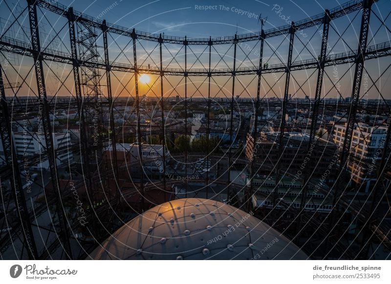Sunset at the Gasometer Sky Cloudless sky Clouds Sunrise Sunlight Summer Beautiful weather Berlin Germany Europe Capital city Downtown Metal Steel Blue Yellow