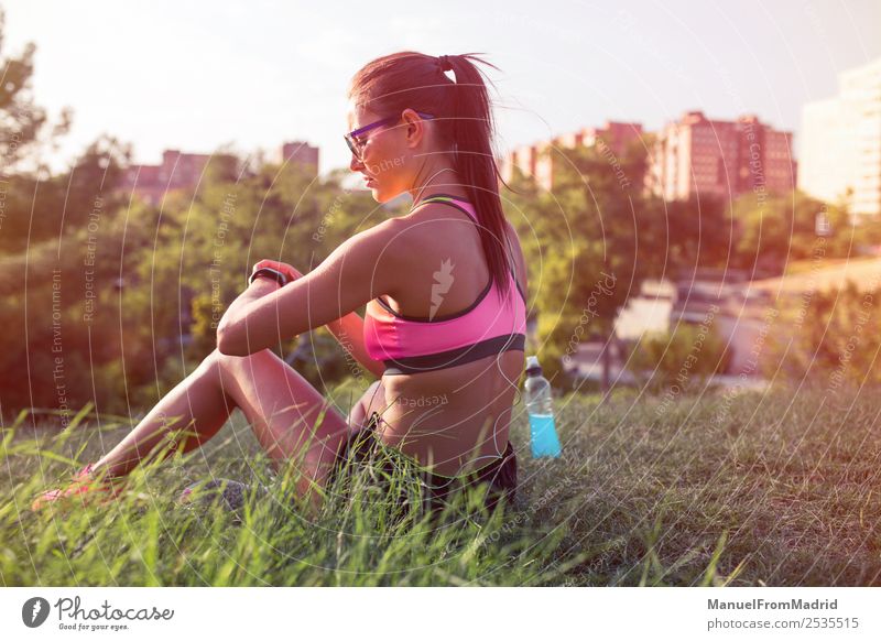 athletic woman resting Bottle Lifestyle Beautiful Summer Sports Technology Woman Adults Nature Park Fitness Sit Energy workout Runner training Resting