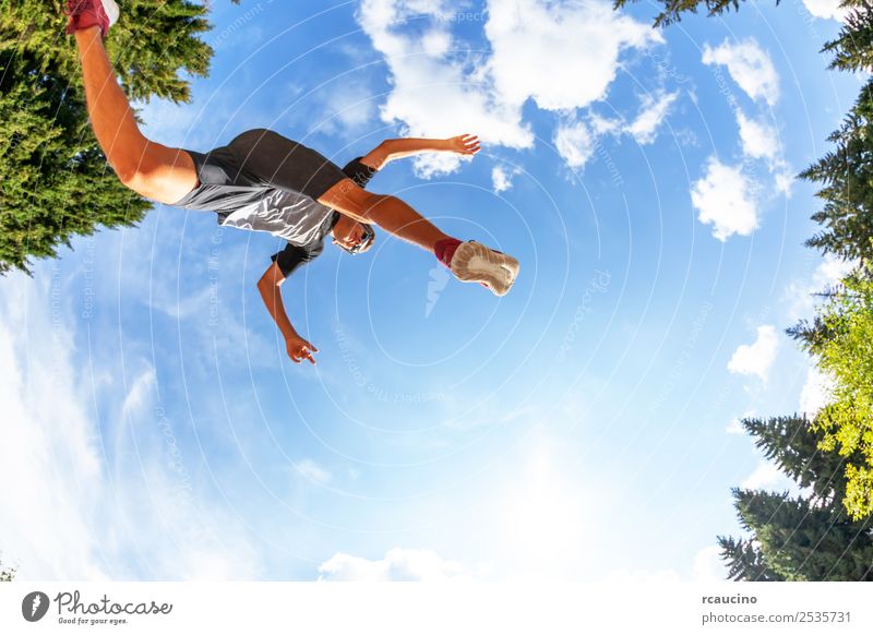 boy makes a jump in a mountain meadow. Lifestyle Joy Happy Relaxation Vacation & Travel Tourism Adventure Summer Sports Success Jogging Human being Boy (child)