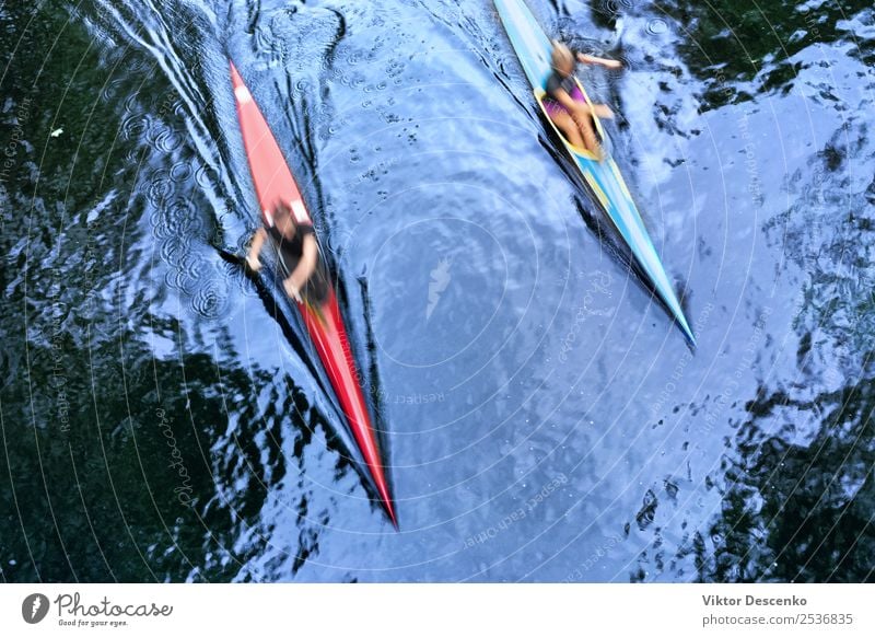 Two kayaks at speed in the water Lifestyle Joy Body Face Summer Sun Beach Ocean Mountain Sports Aquatics Human being Woman Adults Man Hand Culture Nature Sky