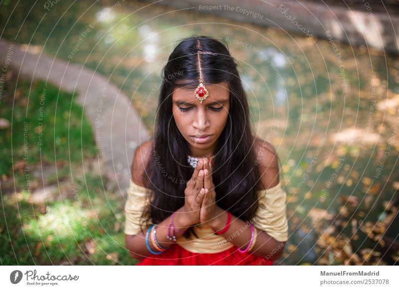 traditional indian woman praying Beautiful Relaxation Meditation Woman Adults Hand Nature Park Fashion Clothing Dress Jewellery Gold Red Religion and faith