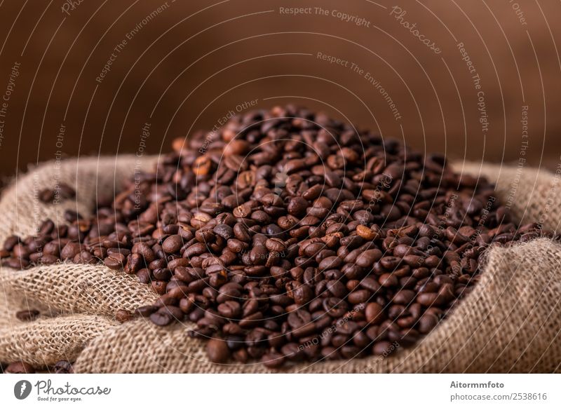 Sack of spilled roasted coffee beans Grain Breakfast Coffee Lifestyle Love Fresh Hot Delicious Natural Brown Energy Colour arabica Aromatic background bag