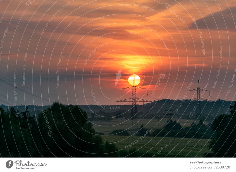 Red rising sun on top of an electric pole Beautiful Technology Environment Nature Landscape Horizon Forest Schwäbisch Hall Germany Village Energy big sun cables