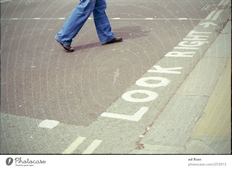 where the streets have a name. Human being Legs Feet 1 Populated Street Crossroads Road sign Going Colour photo Exterior shot Copy Space left Day Long shot