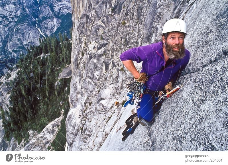 Rock climber ascending Half Dome. Life Adventure Sports Climbing Mountaineering Success Rope Masculine Man Adults 1 Human being 30 - 45 years Helmet Beard
