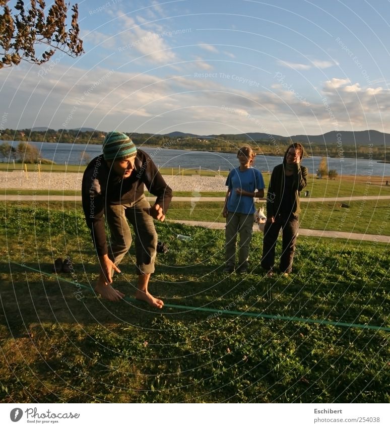 Slackline at the lake Joy Playing Freedom Summer Sports Sportsperson Human being Masculine Young woman Youth (Young adults) Young man Friendship Life 3