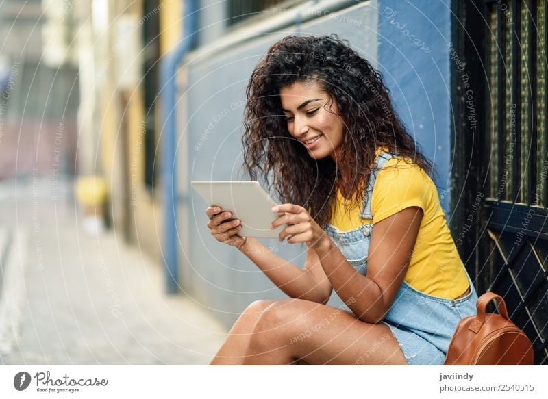 Young Arab woman looking at her digital tablet Lifestyle Style Happy Beautiful Hair and hairstyles Tourism Technology Human being Feminine Young woman