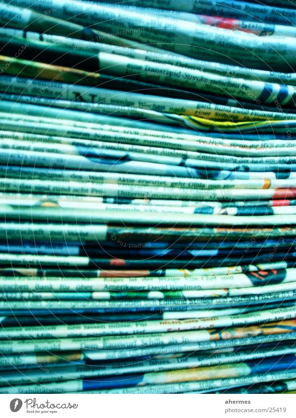 newspapers Media industry Business Newspaper Magazine Paper Sign Blue Text Stack Colour photo Multicoloured Interior shot Close-up Experimental Abstract